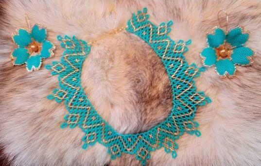 Inspired by the enduring relationship between the land and water, this piece captures the quiet rhythm of the North. Like rivers that carve the landscape and lakes that reflect endless skies, the flowing beadwork evokes movement, resilience, and the stories carried across generations. Each bead reflects the changing light upon the water, celebrating the beauty, strength, and enduring spirit of the North while honoring the timeless connection between people, culture, and the land.