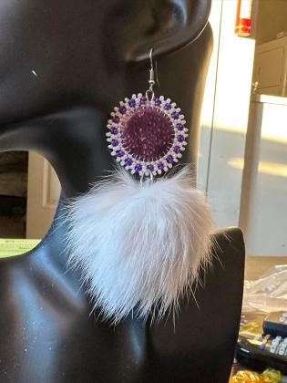 Dyed Purple Arctic char fish skin, backed with smoke tanned moose hide with a rabbit pompom