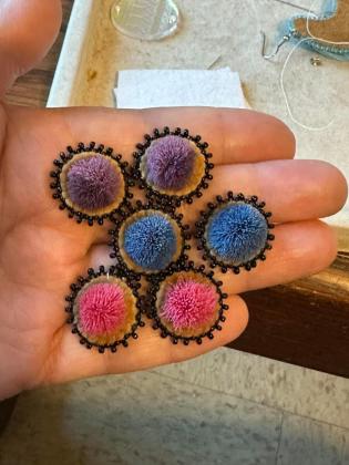 Caribou hair tufted on smoke tanned moose hide studs