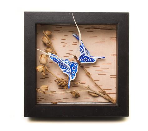 Fish bone butterfly on birch bark 