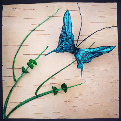 Fish bone butterfly on birch bark with fish rib accents