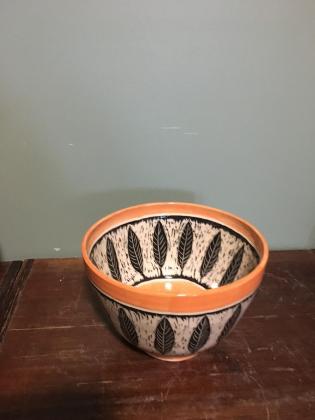 orange bowl with black scraffito leaves