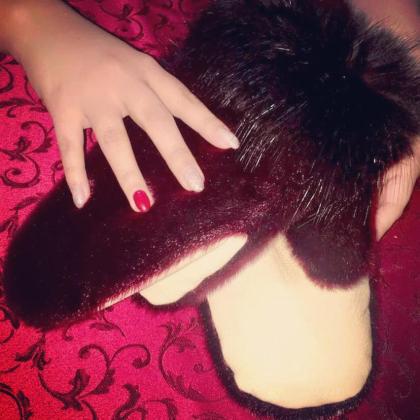 Lavish burgundy mitts with sheared beaver inners.