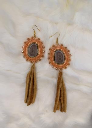 Caribou antler earrings with moosehide