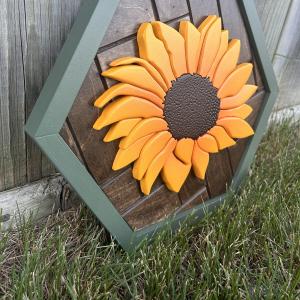 Hand cut sunflower on a hexagon shaped herringbone backrground